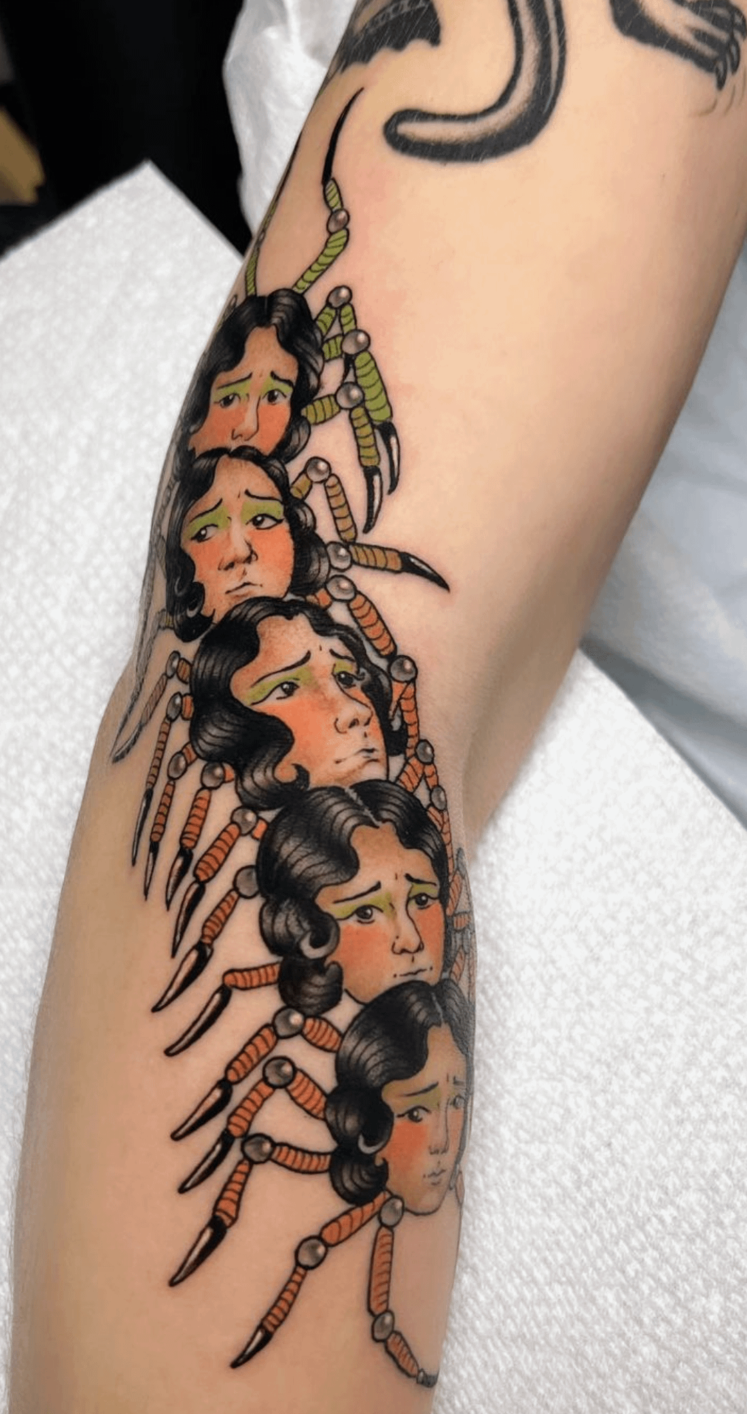 Lady head centipede done by Hannah McKee at Ruby Tiger Tattoo in NC