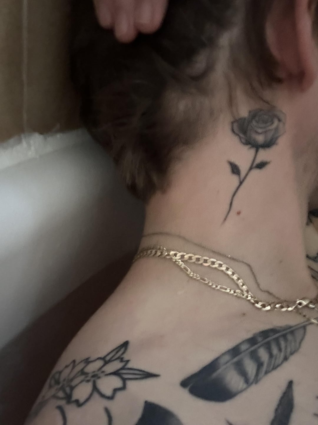 Basic rose neck tat by Erik Luna black coffin tattoo St. Paul mn